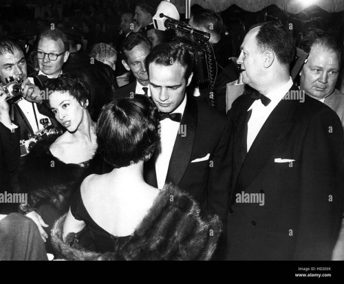 MB-Celia-Merideth-at-Academy--Marlon-Brando-and-his-secretary-Celia-Meredith-arriving-at-the-Academy-Awards-in-the-1950s-Blow-UP.jpg